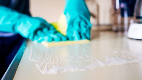 Cleaning a dining chair upholstered in fabric at a Bromley property